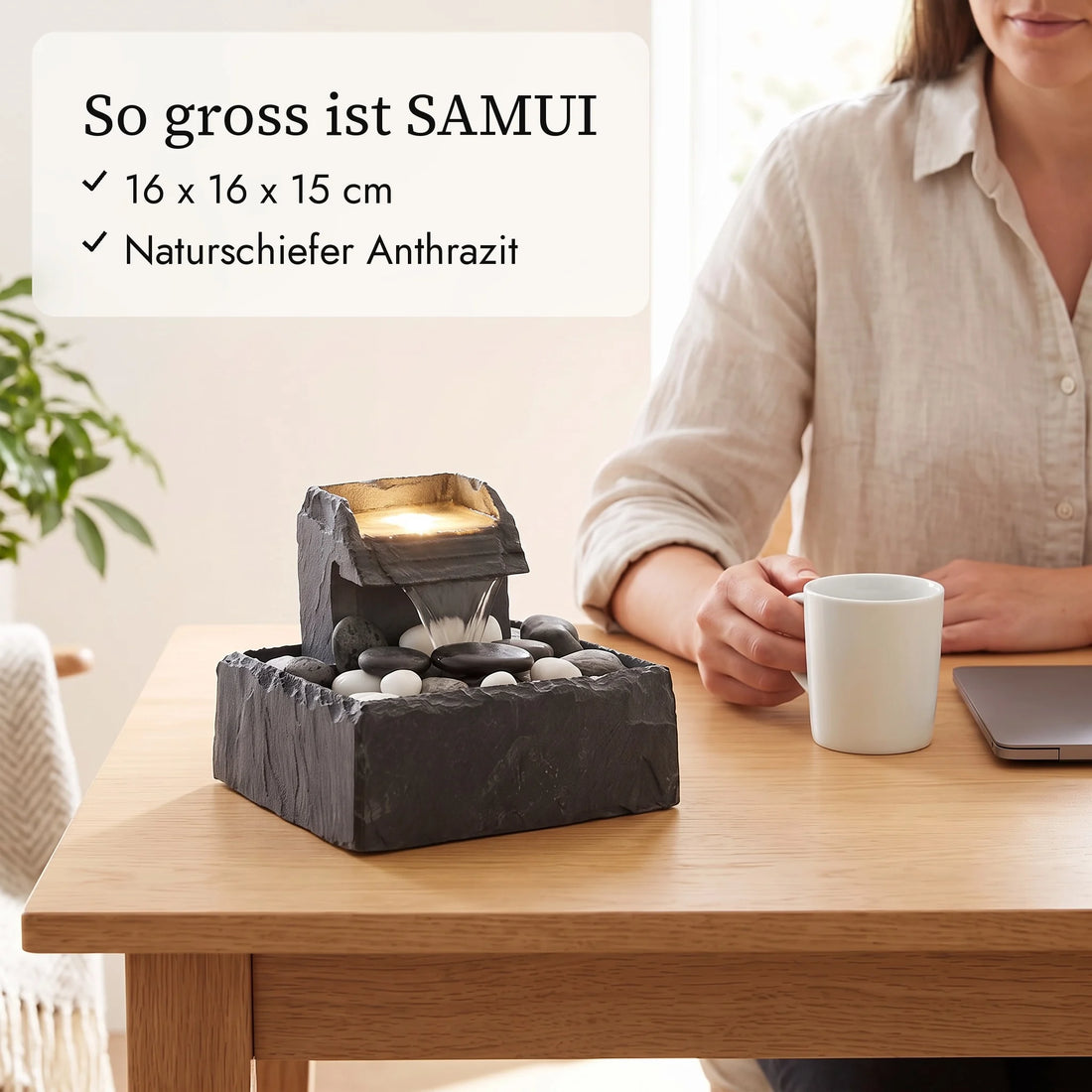Size of SAMUI: tabletop fountain 16 x 16 x 15 cm next to a coffee cup and a hand (AI content)